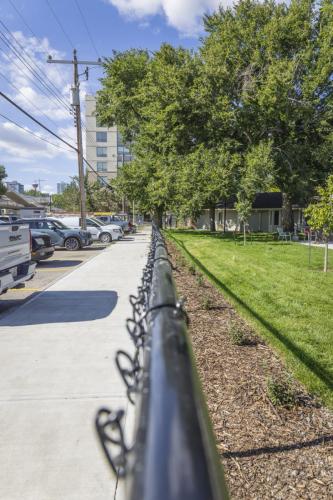 New fence line in front of Bow Valley funneling access towards the front door.