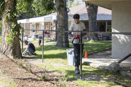 Construction crew working on fence installation.