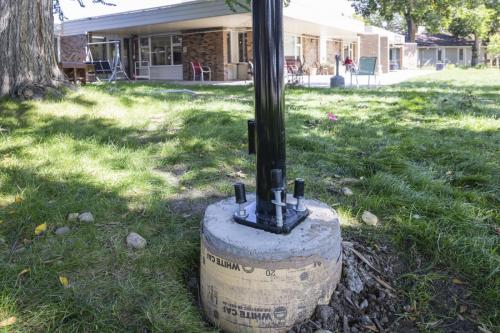 New concrete base and light post.